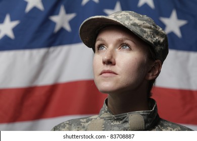 Female Soldier In Front Of US Flag