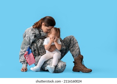 Female Soldier And Her Sad Little Daughter With USA Flag On Color Background