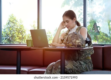 Female Soldier Working With Laptop In The Office Building.