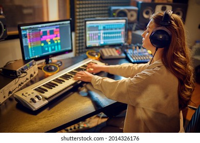 Female sound engineer at mixing consol - Powered by Shutterstock