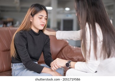 A female Southeast Asian professional psychologist doctor consults in a psychotherapy session with a Southeast Asian female, counsels diagnosis health - Shutterstock ID 2051719586