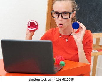 A Female Speech Therapist Conducts An Online Lesson With A Laptop.