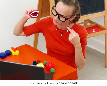 A Female Speech Therapist Conducts An Online Lesson With A Laptop.