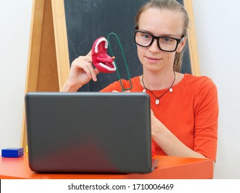 A Female Speech Therapist Conducts An Online Lesson With A Laptop.