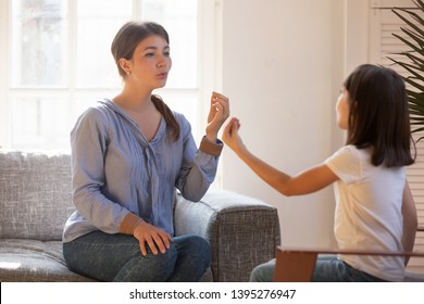 Female Speech Therapist Doing Exercise, Speaking With Little Girl Patient, Stuttering Child Studying With Doctor At Home, Repeat Sounds And Words, Training Articulation And Pronunciation