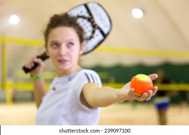Female sportsman on beach tennis game