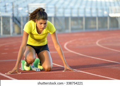 Female Sprinter Getting Ready to Start The Race - Powered by Shutterstock