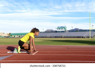 Female Sprinter Getting Ready to Start The Race - Powered by Shutterstock