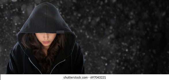 Female Spy In Hoodie Against Black Background