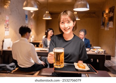 Female staff of a tavern serving beer - Powered by Shutterstock