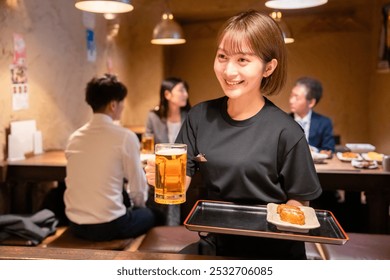 Female staff of a tavern serving beer - Powered by Shutterstock