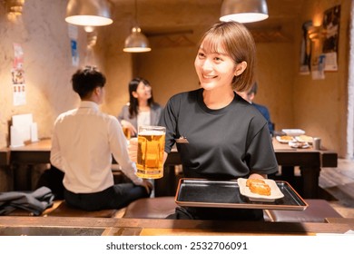 Female staff of a tavern serving beer - Powered by Shutterstock