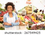 Female Stall Holder At Farmers Fresh Food Market