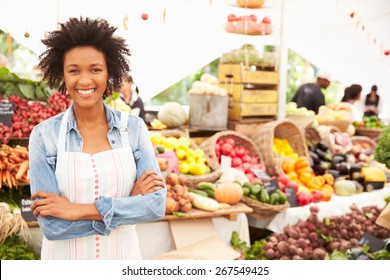 Female Stall Holder At Farmers Fresh Food Market