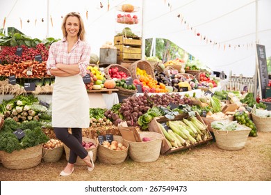 Female Stall Holder At Farmers Fresh Food Market