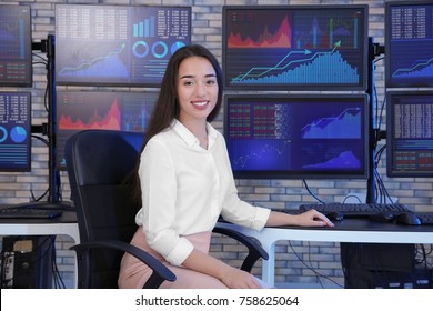 Female Stock Trader Working In Office