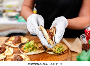 Female Street Vendor Hands Making Taco Outdoors. Mexican Cuisine Snacks, Cooking Fast Food For Commercial Kitchen.