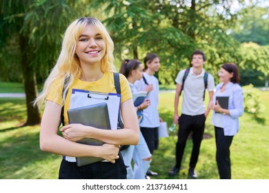 Female Student 16, 17 Years Old With Textbooks Backpack, In School Park