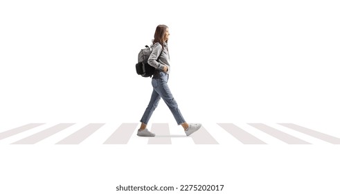 Female student with a backpack walking on a pedestrian crossing isolated on white background