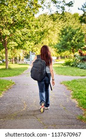 Female Student With A Backpack, Walking In Park La Fontaine In Montreal Quebec Canada On A Bright Sunny Day