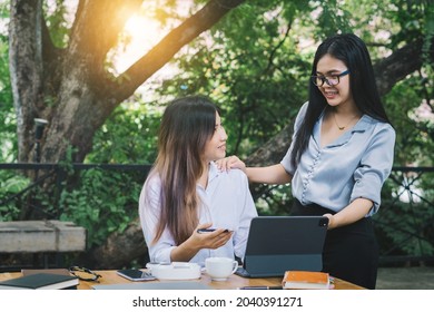 Female Student And Her Friend Studying Online With A Teacher Via Videoconferencing, Feeling Happy And Smile, Study Online At Home.