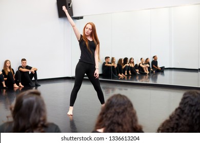 Female Student At Performing Arts School Performs Street Dance For Class And Teacher In Dance Studio