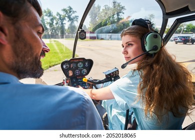 Female student pilot taking aviation lesson with private tutor - Powered by Shutterstock