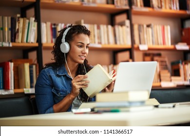 Female student study in the school library.She using laptop and learning online for university  exam. - Shutterstock ID 1141366517