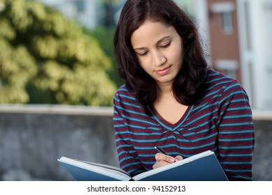 Female Student Studying Outdoors