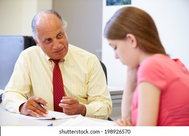 Female Student Talking To High School Counselor