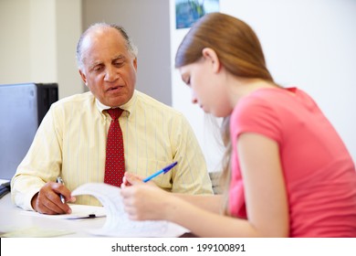 Female Student Talking To High School Counselor