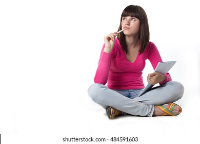 female student thinking with note pad.