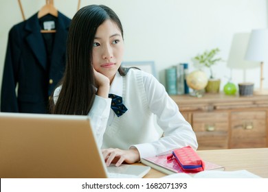 A female student wearing a uniform to study