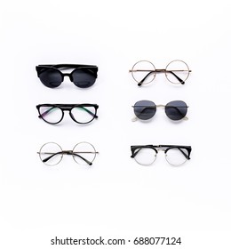 Female Sunglasses On White Background. Flat Lay, Top View. 