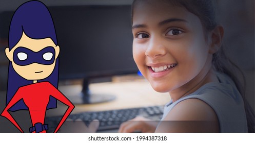 Female Superhero Icon Against Portrait Of Girl Smiling While Using Computer. Girl Power And Education Concept