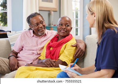 Female Support Worker Visits Senior Couple At Home