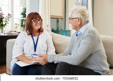 Female Support Worker Visits Senior Man At Home