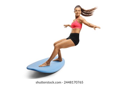 Female surfer riding a surfboard isolated on white background - Powered by Shutterstock