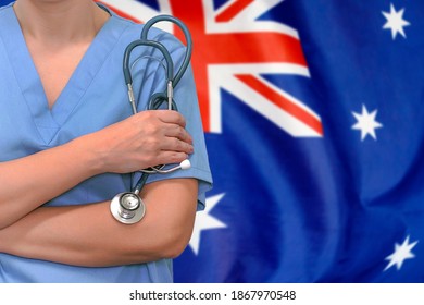 Female Surgeon Or Doctor With Stethoscope In Hand On The Background Of The Australia Flag. Surgery Concept In Australia