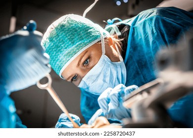 Female surgeon managing a simulated facial trauma - Shutterstock ID 2258720437