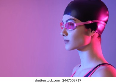 Female swimmer on color background, closeup - Powered by Shutterstock