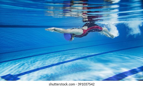 Female Swimmer Swimming Pool.Underwater Picture