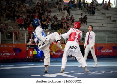 Female Taekwondo Fighter Combat During Match. World Taekwondo Championship, Rome, Italy, June 4 2022