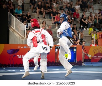 Female Taekwondo Fighter Combat During Match. World Taekwondo Championship, Rome, Italy, June 4 2022