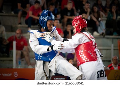 Female Taekwondo Fighter Combat During Match. World Taekwondo Championship, Rome, Italy, June 4 2022