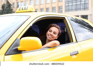 Female Taxi Driver In Car