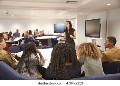 Female Teacher Addressing University Students In A Classroom