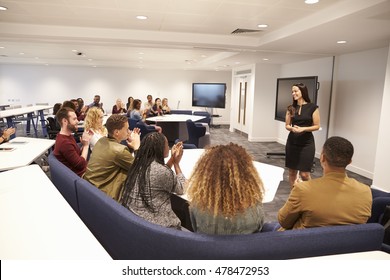 Female Teacher Addressing University Students In A Classroom