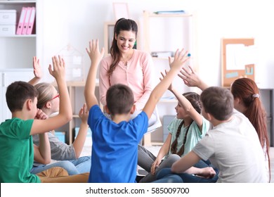 Female Teacher Conducting Lesson At School