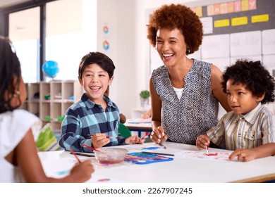 Female Teacher With Multi-Cultural Elementary School Pupils In Art Class At School - Shutterstock ID 2267907245